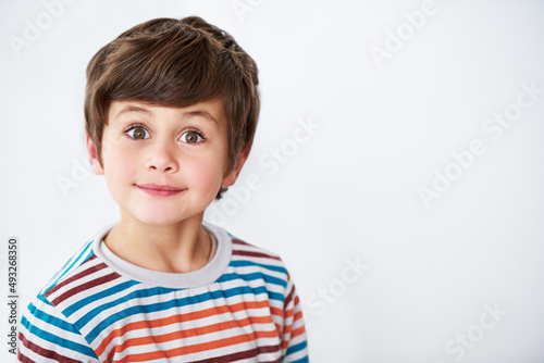 Stop staring now. Shot of a cute little boy looking at the camera.