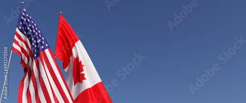 US and Canadian flags on flagpoles on side. Flags on a blue background. Place for text. United States of America. Ottawa. Maple leaf. Commonwealth. 3D illustration.
