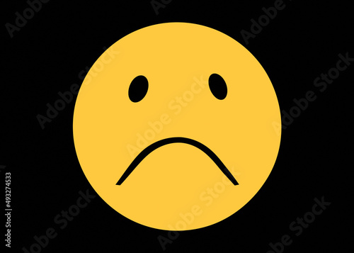 фотографія A sad emoji (smile), drawn in a simple style, a yellow round shape over a black background, with a goofy expression and a dark yellow color