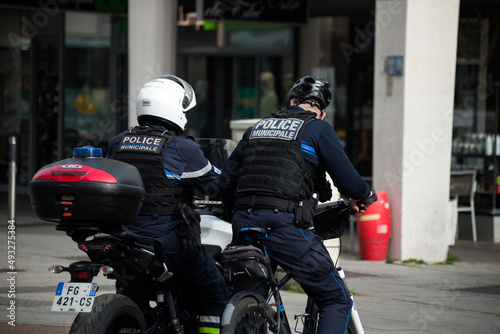 Mulhouse - France - 17 March 2022 - Portrait of french municipal policemen and motorbike and bycicle  in the street photo