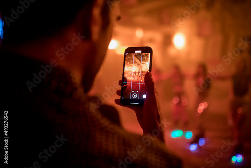 Close up view of a phone recording during a music and dancing show