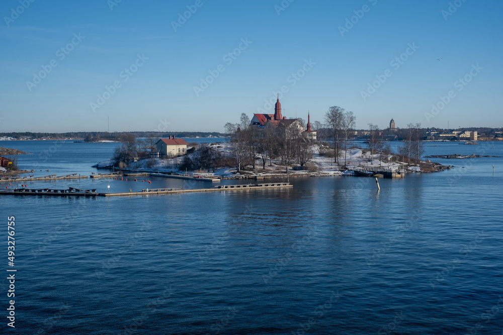 A view from the south harbor towards the sea. An old mansion in the middle of Helsinki.
