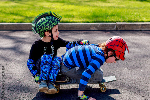 Brother having fun skate boarding photo