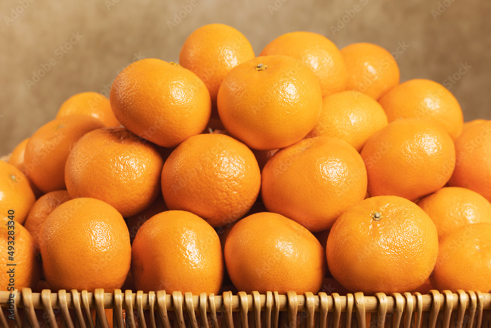 Ripe tangerines in a basket close-up. Selective focus.