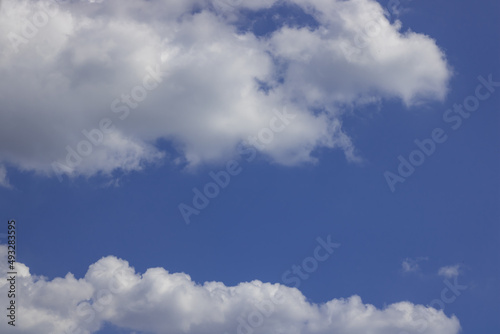Beautiful blue sky and fluffy white clouds natural background.