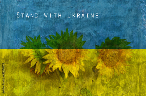 old blue yellow grunge wall background with flag of Ukraine and with the inscription 