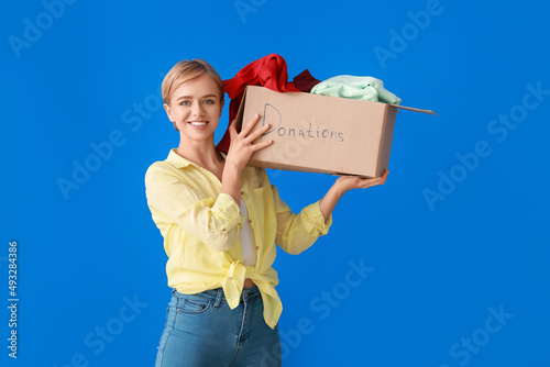 Young woman holding box wit...