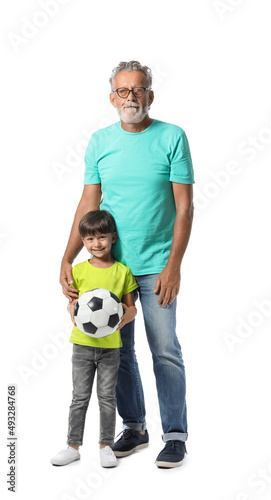 Little boy and his grandfather with ball on white background