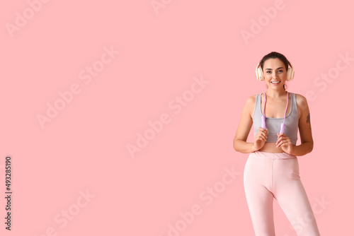 Sporty young woman with ski...