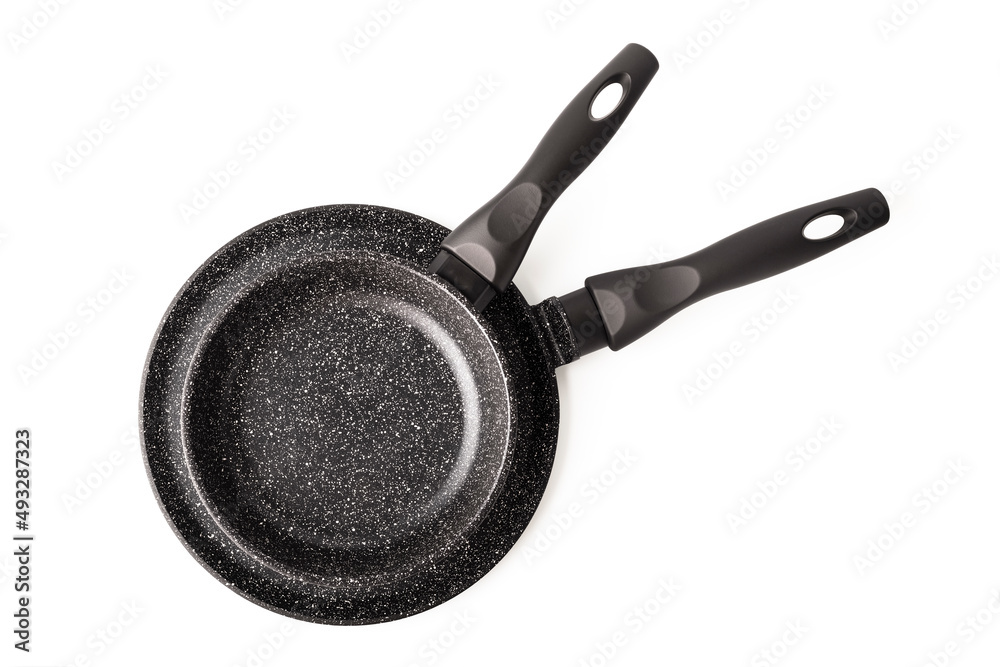 Set of two frying pans on a white background. Concept of kitchen utensils, top view. isolated object Set of two frying pans on a white background. Concept of kitchen utensils, top view. isolated object