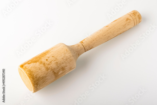 Wooden pusher for mashed potatoes. Kitchen tool concept