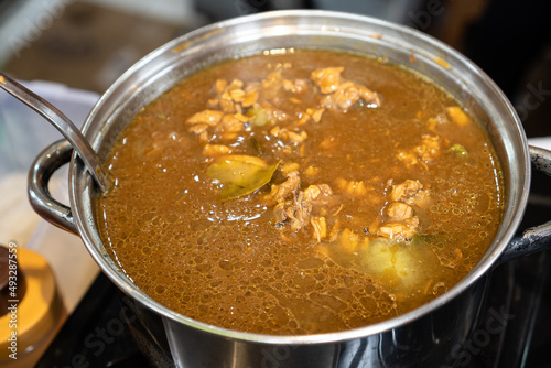 A chicken curry on bit pot