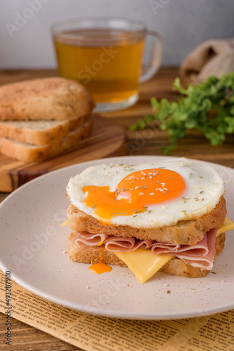 french sandwich croque madame with egg,ham and cheese