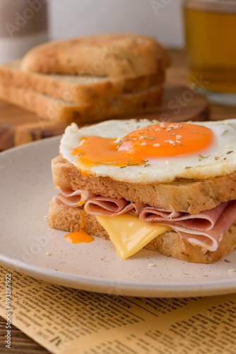 french sandwich croque madame with egg,ham and cheese