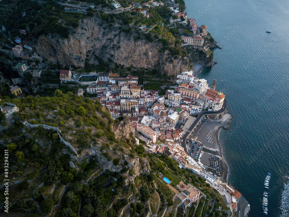 Small seaside town on a sunrise (aerial drone photo). Mediterranean, Amalfi, Italy