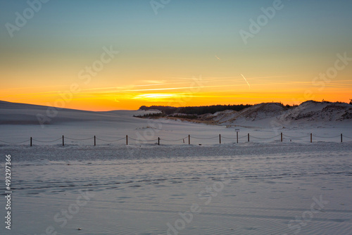 Fototapeta Naklejka Na Ścianę i Meble -  Beautiful scenery of sand dunes in the Slowinski National Park at sunset, Leba. Poland