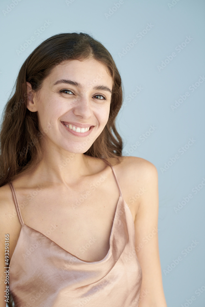 Cheerful beautiful brunette on a light background Cheerful beautiful brunette on a light background