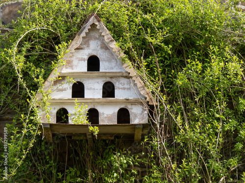 Old wooden dovecote on wall. photo