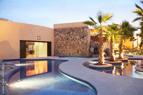 Spa building and pool at sunset