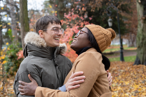 happy couple in love, smiling, rainy cold weather photo