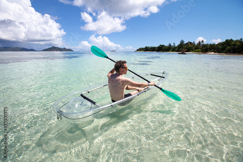 adventure travel, kayak on tropical beach in Seychelles photo