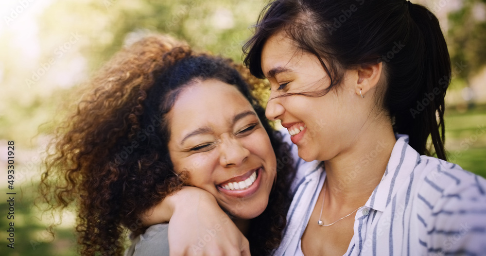 Were enjoying our day together. Shot of two attractive young women posing together while relaxing outdoors. Were enjoying our day together. Shot of two attractive young women posing together while relaxing outdoors.