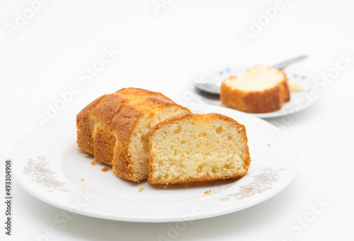 slices of freshly baked pound cake over on white background