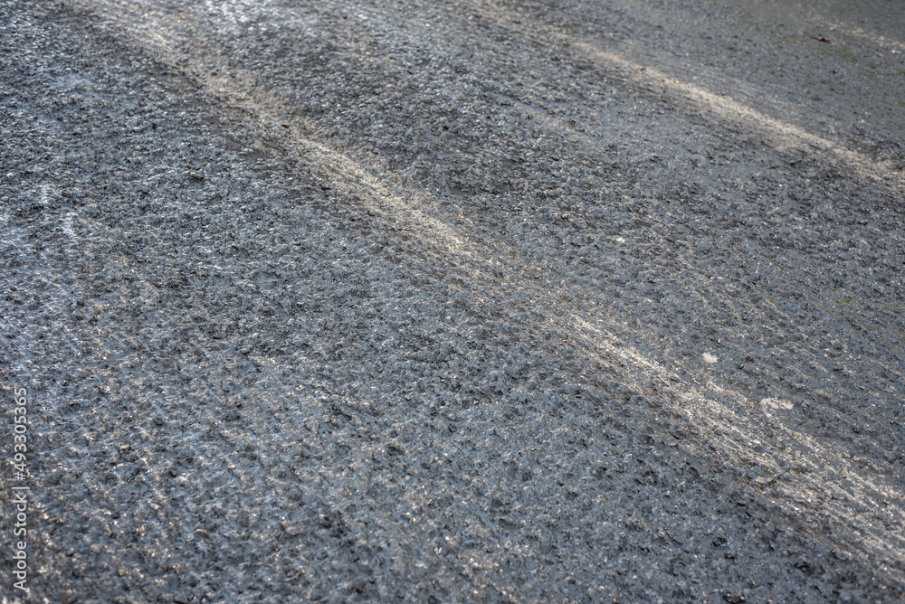 the surface of a milled tarmac road