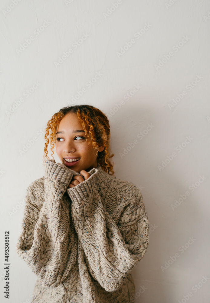 Teenage inside a big wool sweater feeling hygge season Teenage inside a big wool sweater feeling hygge season