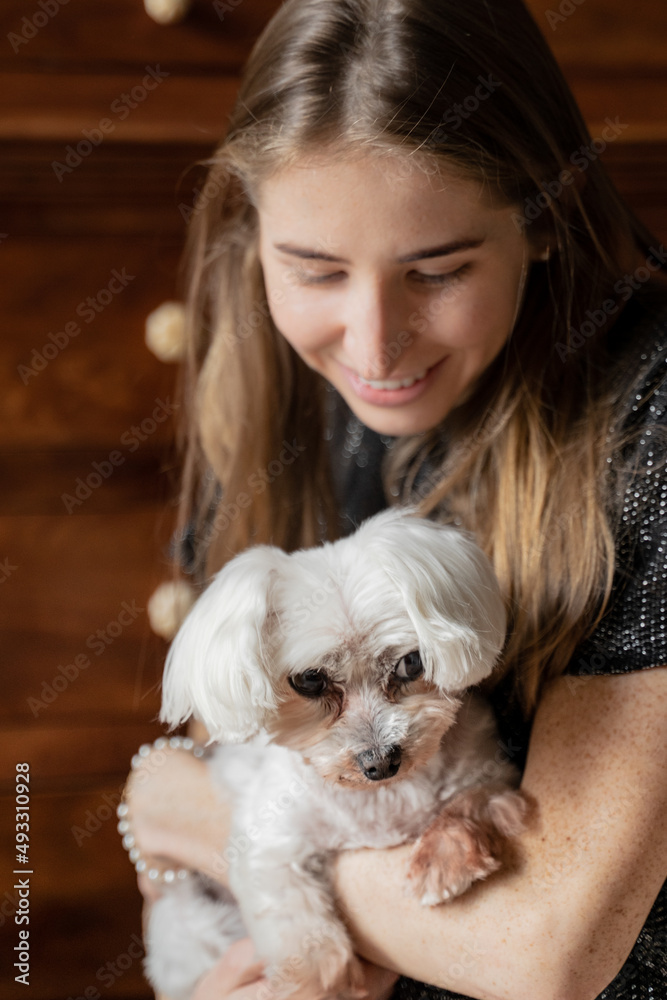 Happy Woman Holding Cute White Dog Happy Woman Holding Cute White Dog