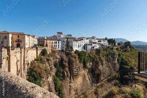 Scenic view of the famous white village of Ronda located on El Tajo gorge at daylight, Malaga province, Andalusia, Spain
