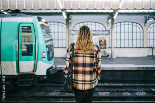 Unrecognizable woman waiting for train photo