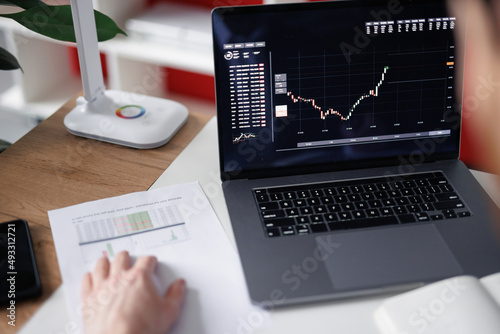 Faceless broker checking stock prices