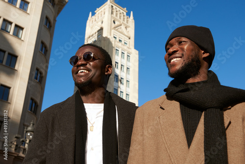 Two Happy Men friends exploring the city photo