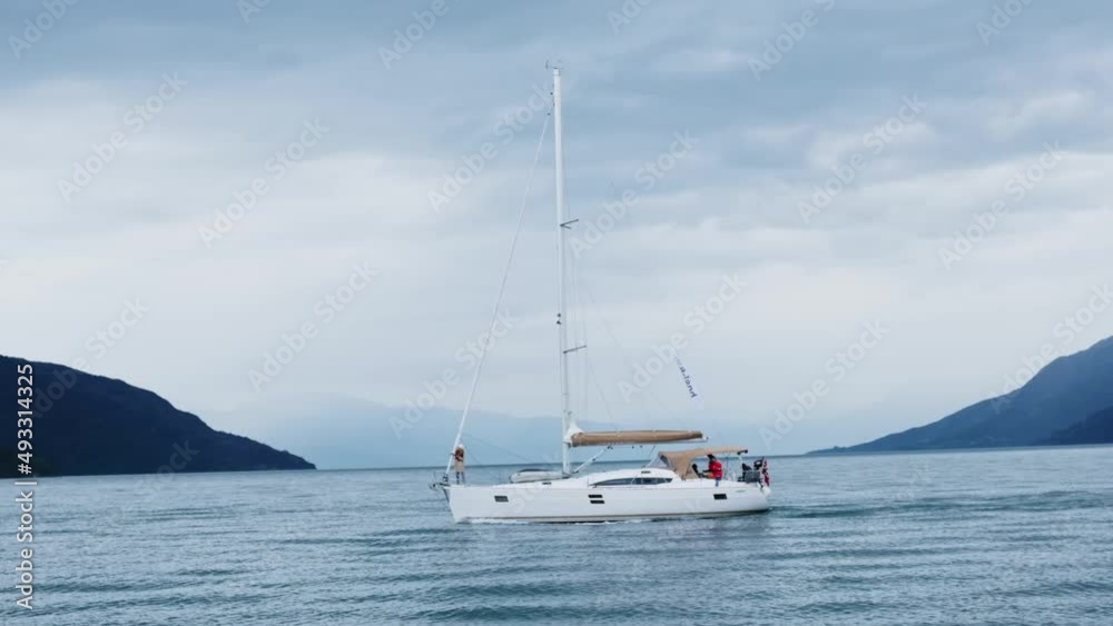 A yacht in slow mo sails on the sea in Norway A yacht in slow mo sails on the sea in Norway