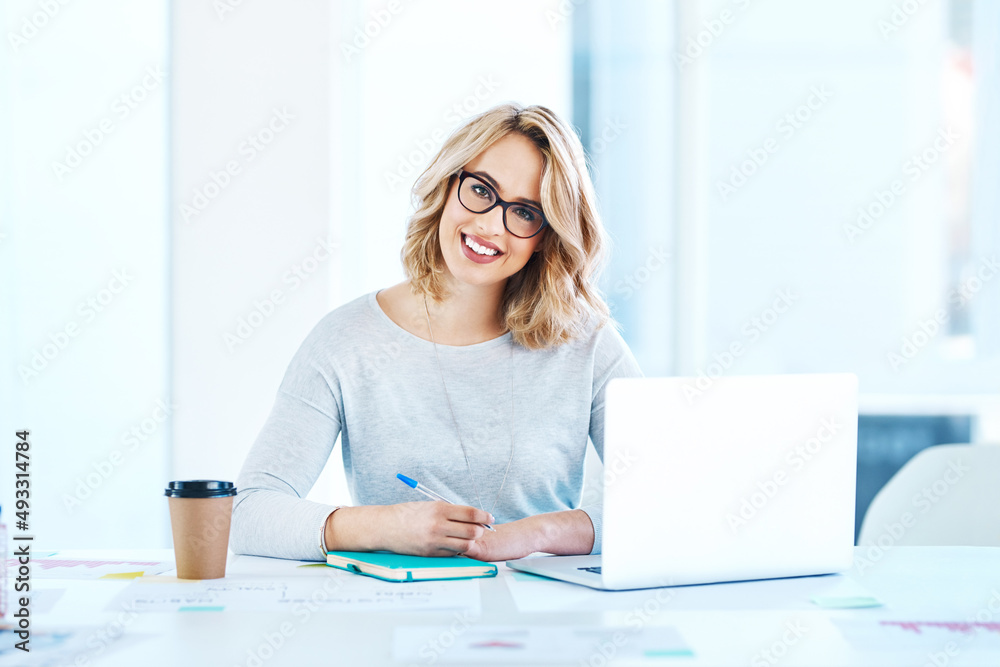 Challenge yourself to do better each day. Portrait of an attractive young businesswoman working on a laptop in an office. Challenge yourself to do better each day. Portrait of an attractive young businesswoman working on a laptop in an office.