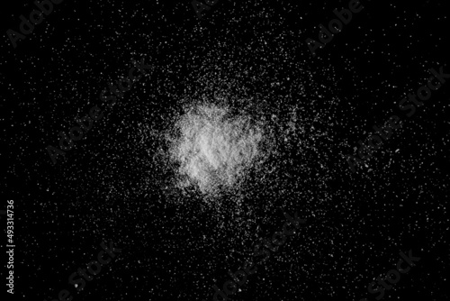 Kitchen salt crystals isolated on black, top view
