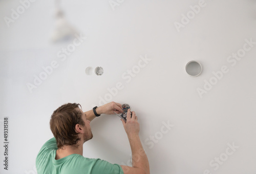 Man Installing Electricity photo