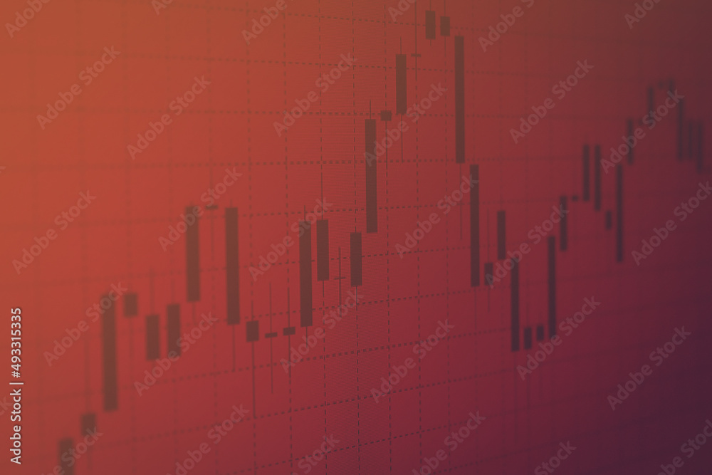 Financial market online chart on screen. Financial, business concept with a candle chart on a red background. Market price analysis