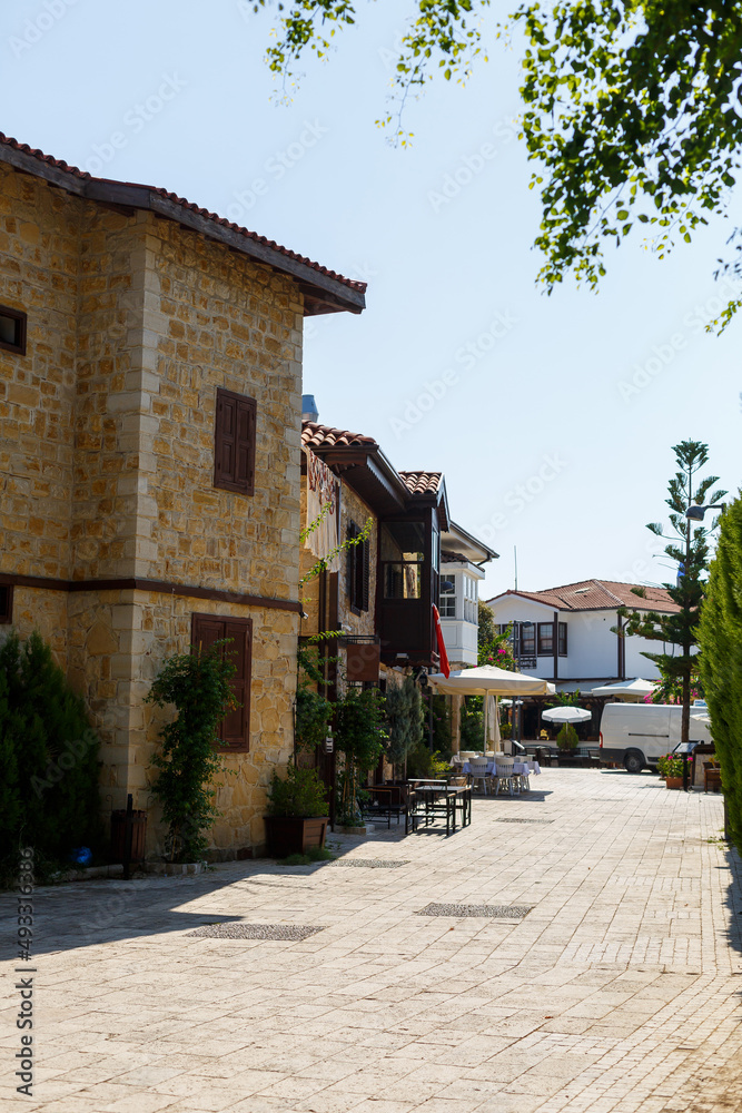 Traditional Greek old street with houses and paving stones