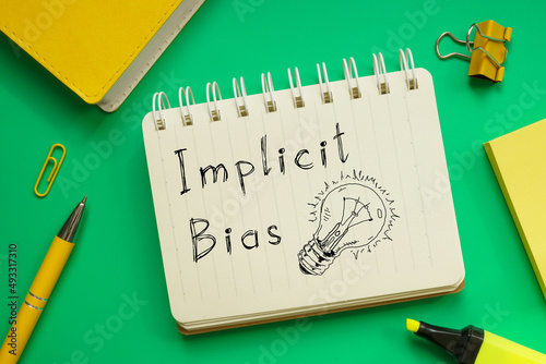 Foto Implicit bias is shown on the business photo using the text