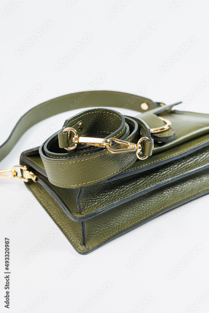 Green leather women's handbag, women's bag, green women's bag. Women's bag isolated on white background. The bag is isolated on a white background.