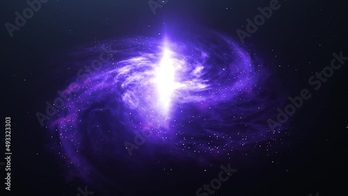 A spiral galaxy in the dark starry sky. The camera slowly zooms in on the purple galaxy. Rotating Nebula space animation in 3d.  Ideal for meditation background and relaxation music. photo