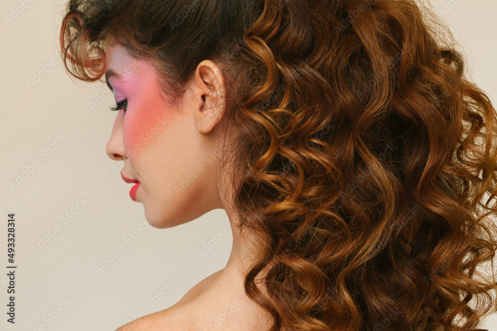 Woman with eighties make-up and long curly hair Woman with eighties make-up and long curly hair