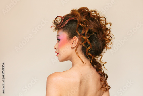 Woman with an eighties hairstyle and curly hair photo