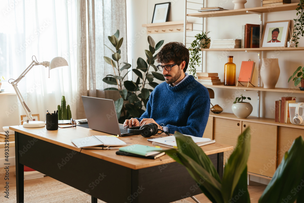 Man working on remote project on laptop Man working on remote project on laptop