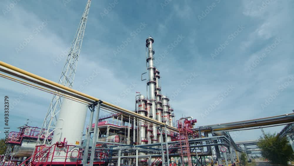 Modern equipment with a pipe or a powerful technological zone at an oil depot or tank farm. Extraction of rock oil for supplies. Engineering complex for processing and delivery. Modern equipment with a pipe or a powerful technological zone at an oil depot or tank farm. Extraction of rock oil for supplies. Engineering complex for processing and delivery.