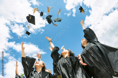 Grad: Recent Graduates Toss Their Caps In The Air photo