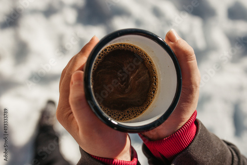 hiker drink coffee in mountains