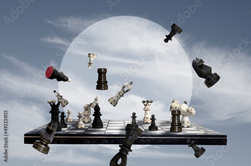 Chess pieces and chess board on sky background